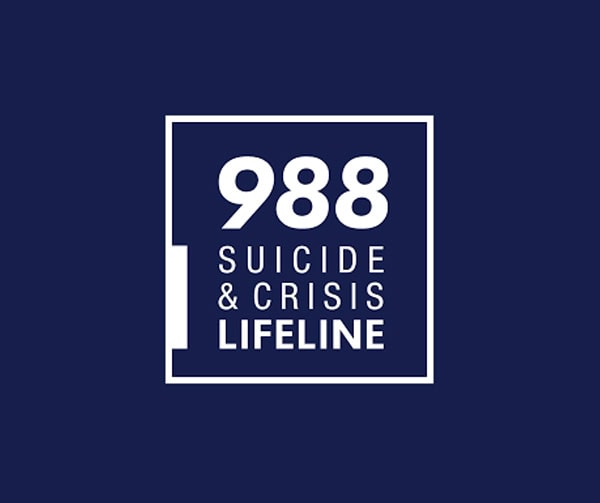 A dark blue square with white text that reads 988 Suicide & Crisis Lifeline inside a white outlined box.