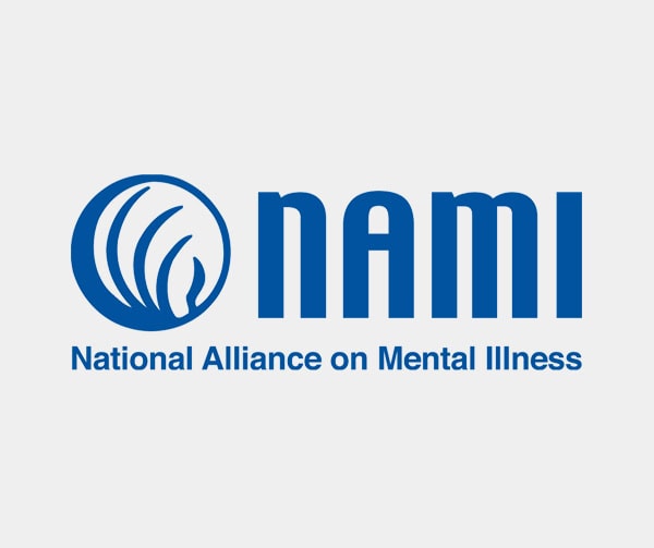 NAMI logo featuring a blue abstract circular design next to the bold blue text “NAMI” and the words “National Alliance on Mental Illness” below it on a light gray background.